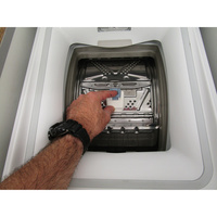 Whirlpool TDLR6268FR - Bouton d'ouverture des portillons