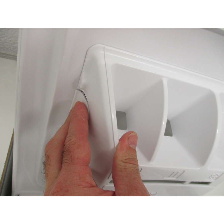 Brandt BT16524Q - Bouton de retrait du bac à produits