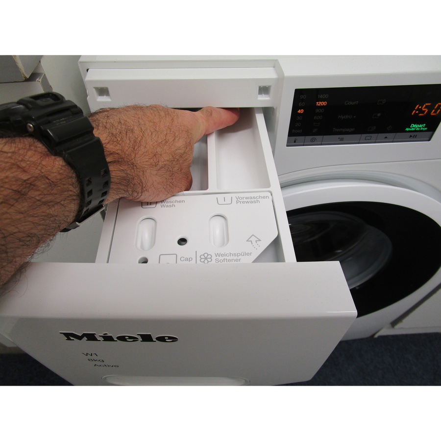 Miele WWA120WCS - Bouton de retrait du bac à produits